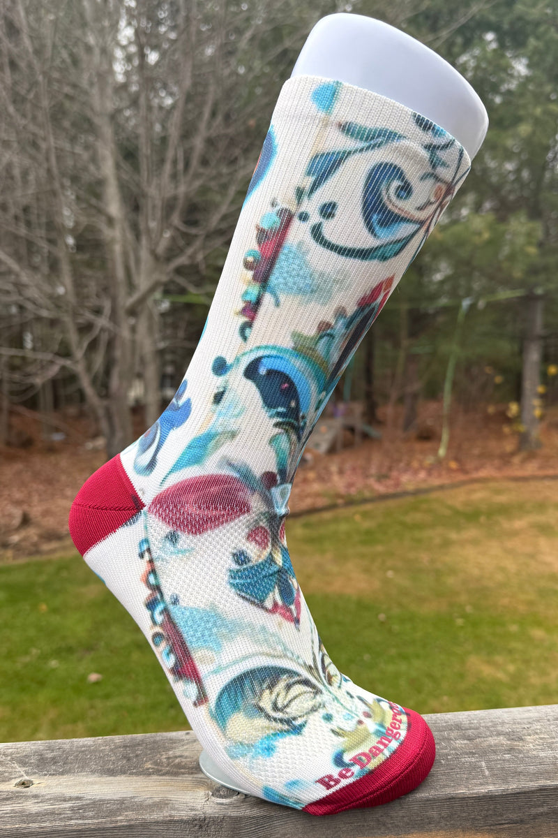 Light compression sock with a red and blue pattern good for office or athletic attire